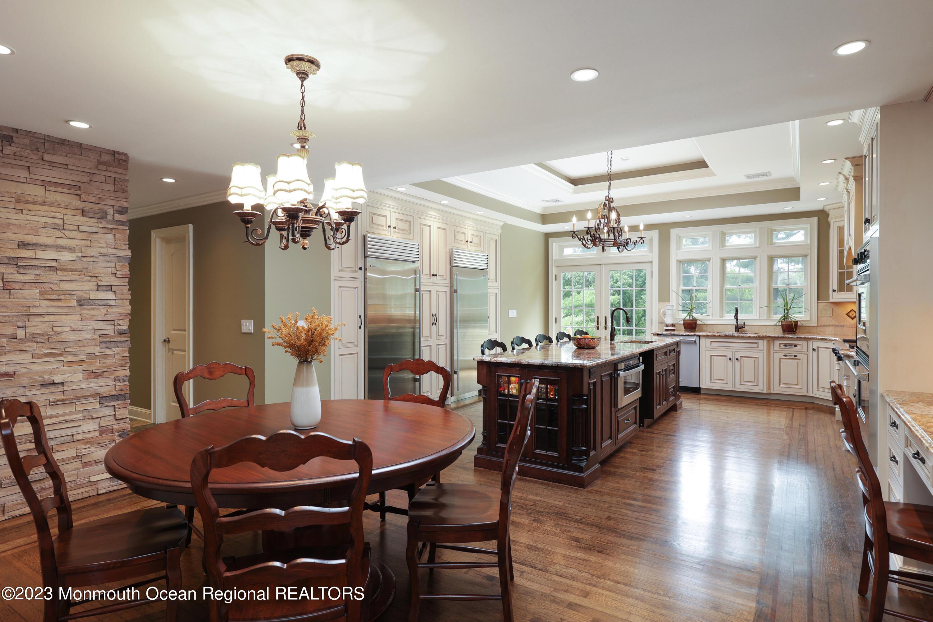 113 Ballantine Road Middletown, NJ 07748 - Photo 3 of 15 a view of a dining room with furniture wooden floor and chandelier