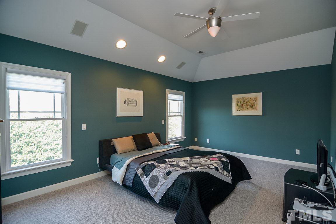 4601 Mentone Way Raleigh, NC 27612 - Photo 22 of 25 a bedroom with a bed and window
