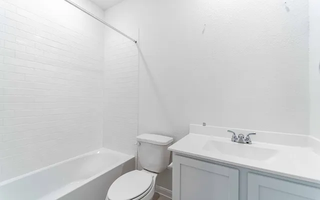 a bathroom with a sink and toilet