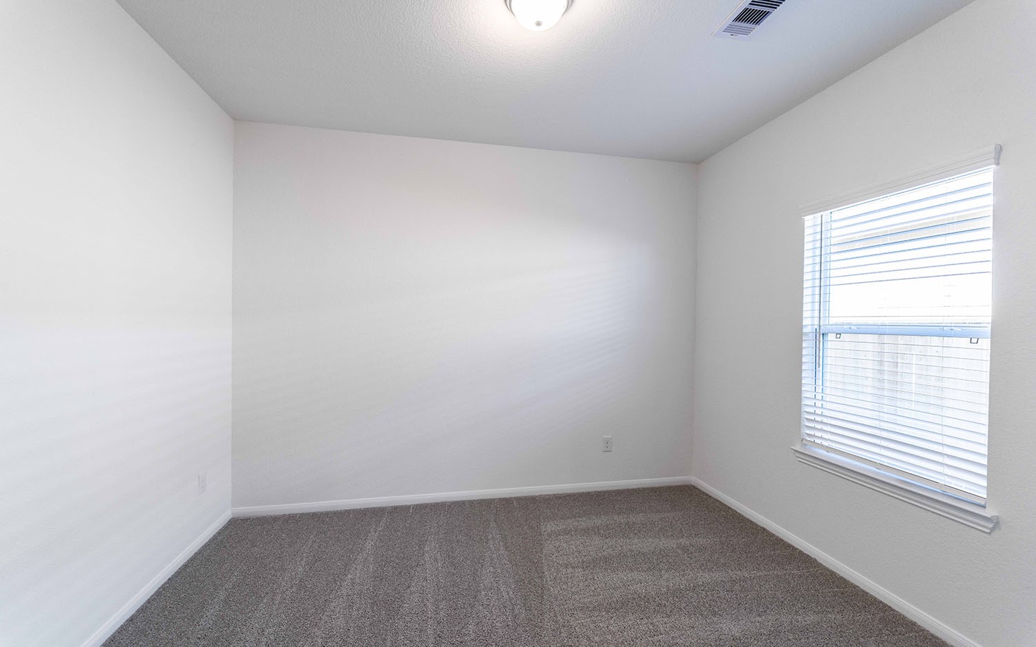 426 Monarch Trail Huntsville, TX 77340 - Photo 2 of 16 an empty room with a window