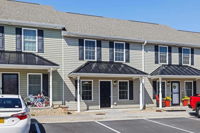 a view of a brick building with many windows
