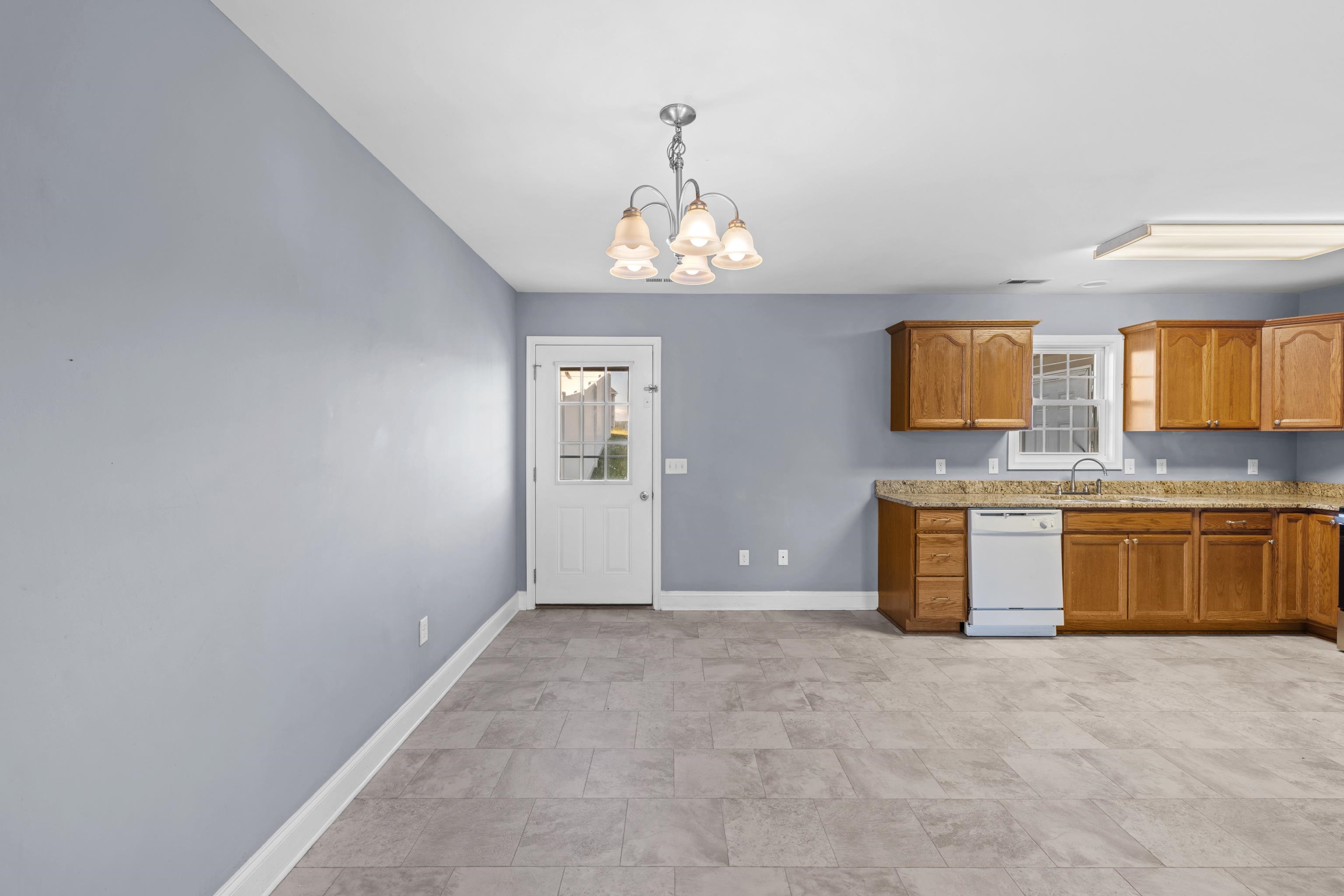 805 Carson Circle Grottoes, VA 24441 - Photo 19 of 40 a view of an empty room with a kitchen