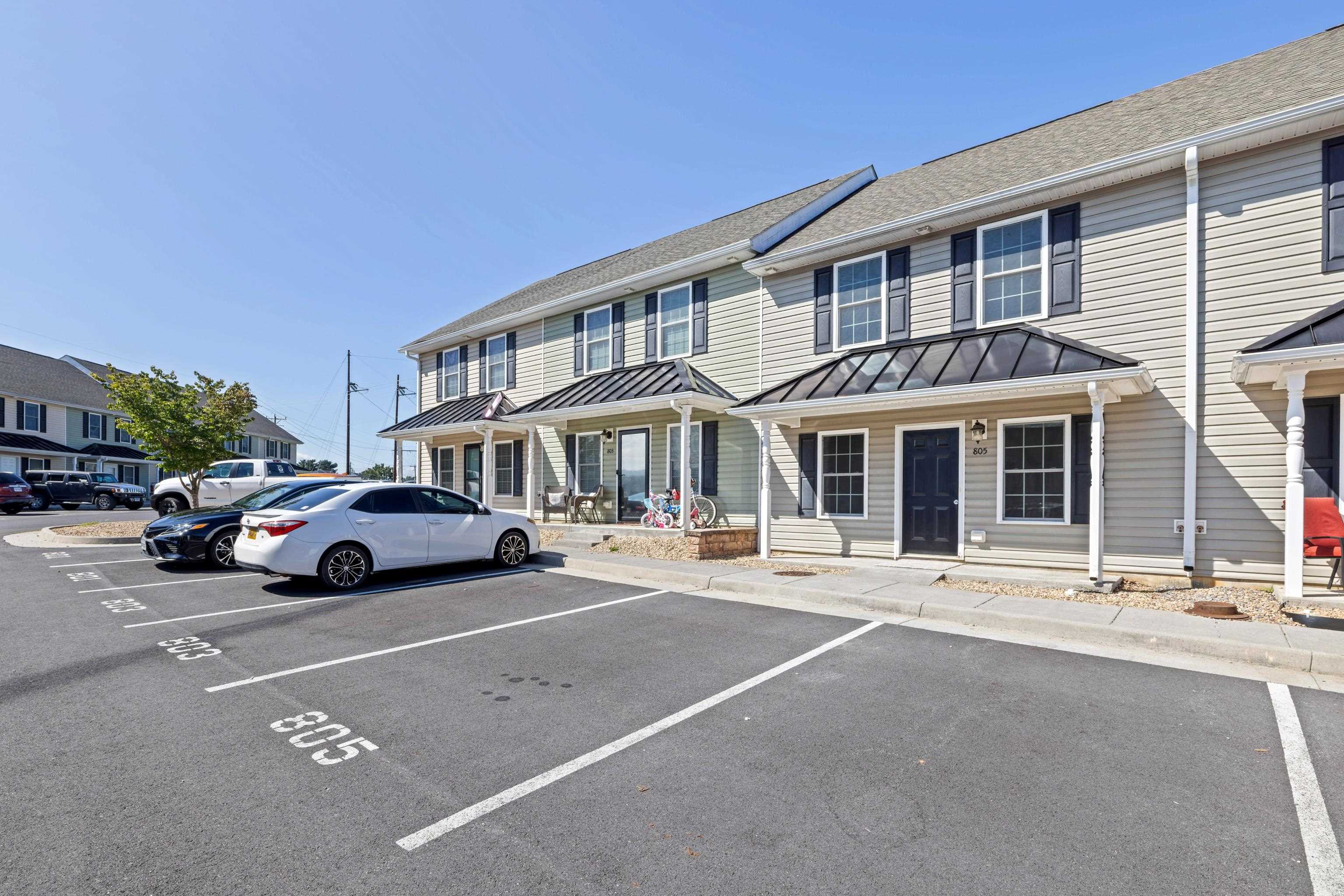 805 Carson Circle Grottoes, VA 24441 - Photo 3 of 40 a front view of a residential apartment building with a yard