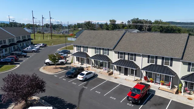 a view of a house with backyard and porch