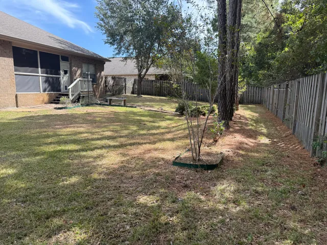 a view of a playground with a tree