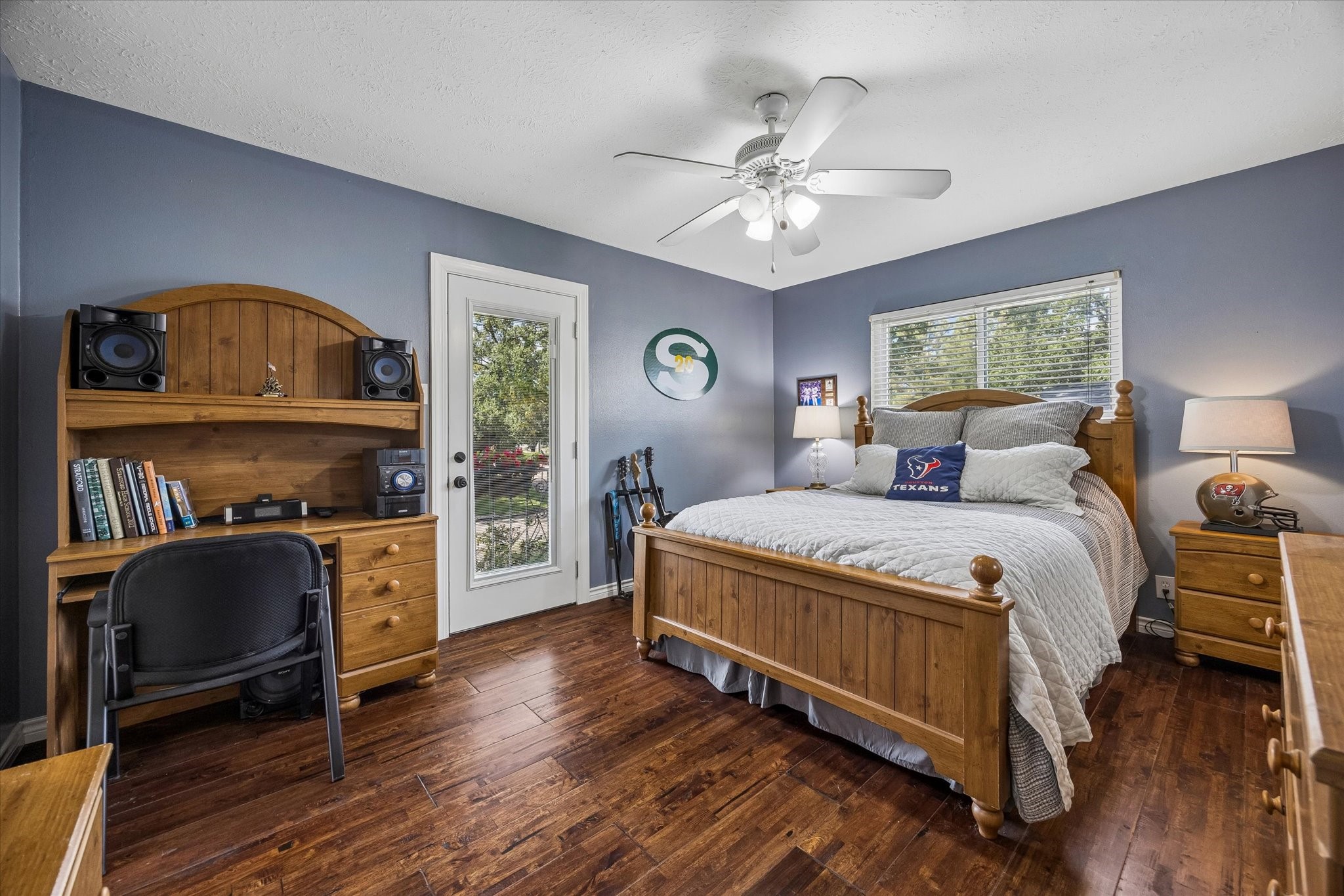 13926 Perthshire Road Houston, TX 77079 - Photo 22 of 31 This large secondary bedroom overlooks the front yard. Glass door opens to a balcony overlooking the front yard, offering a pleasant outdoor spot to enjoy the surrounding mature trees and neighborhood views.