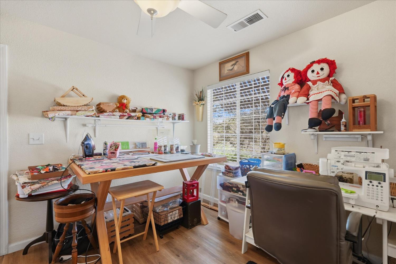 32583 River Knolls Road Coarsegold, CA 93614 - Photo 29 of 63 a dining room with furniture a rug and wooden floor