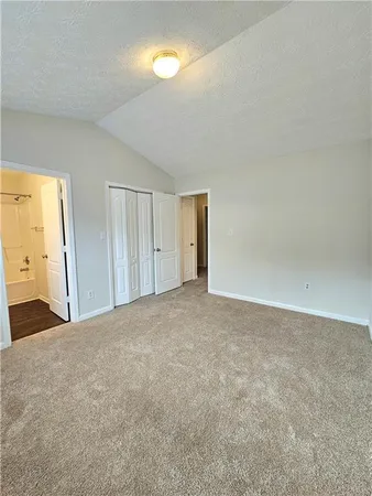 a view of an empty room and a window