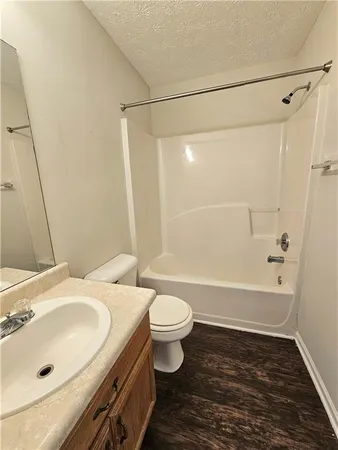 a bathroom with a sink a toilet and a bathtub