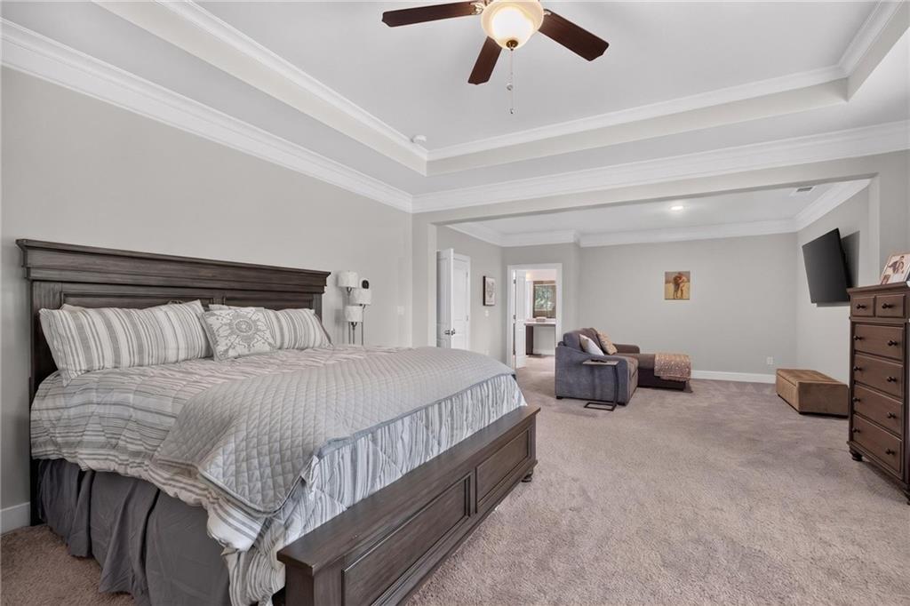 139 Manchester Lane Villa Rica, GA 30180 - Photo 31 of 60 a bedroom with bed and a chandelier