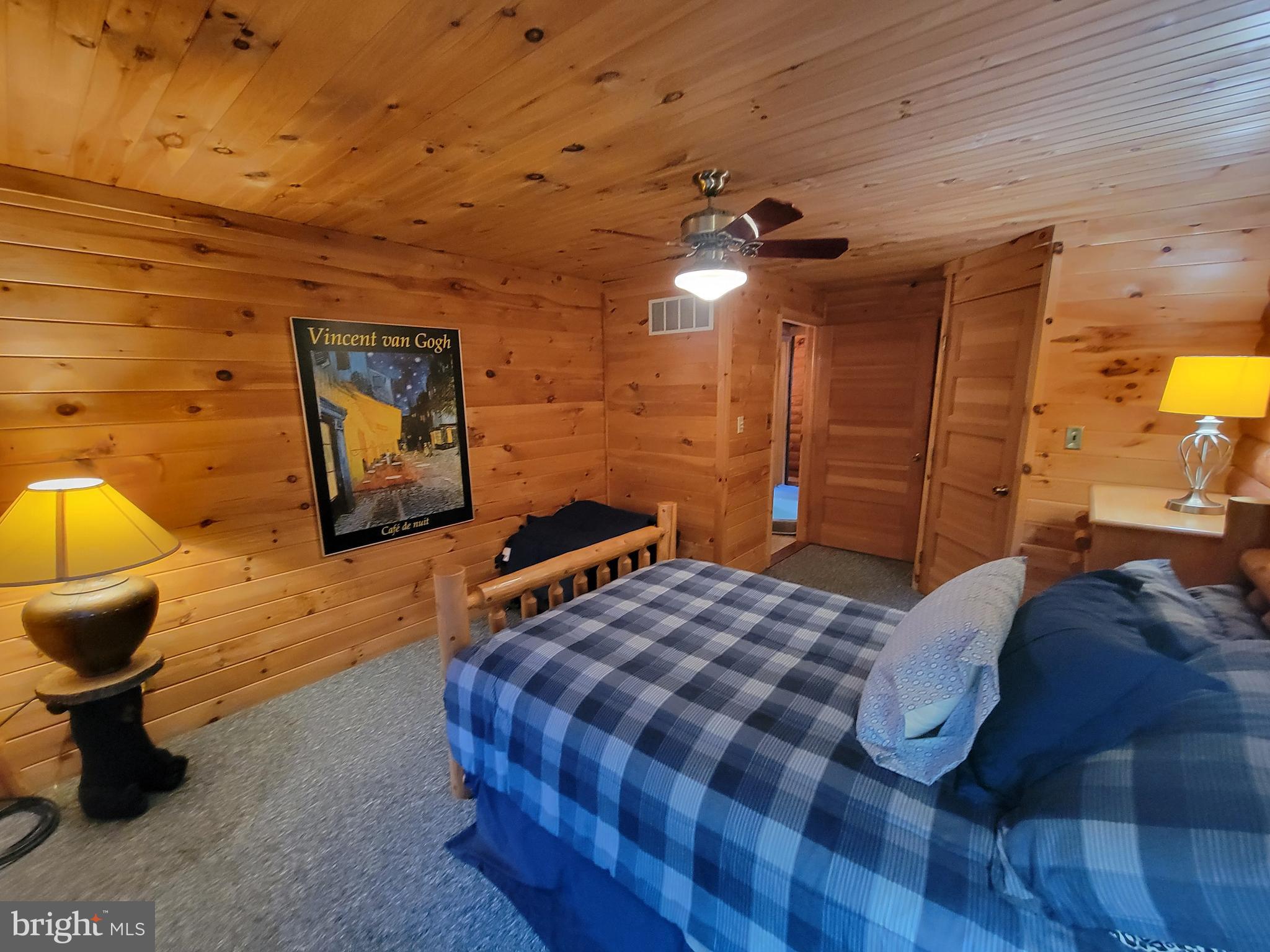 678 Walker School Road Townsend, DE 19734 - Photo 22 of 32 a bedroom with a bed and a chandelier