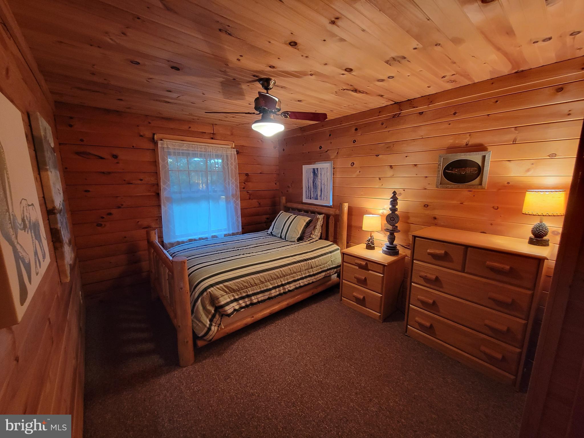 678 Walker School Road Townsend, DE 19734 - Photo 24 of 32 a spacious bedroom with a bed and a dresser