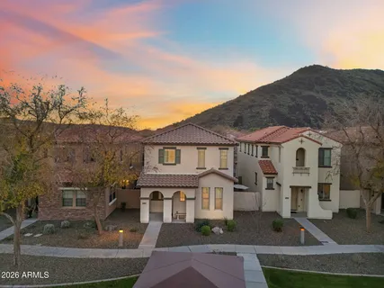 an aerial view of a house with balcony and outdoor space