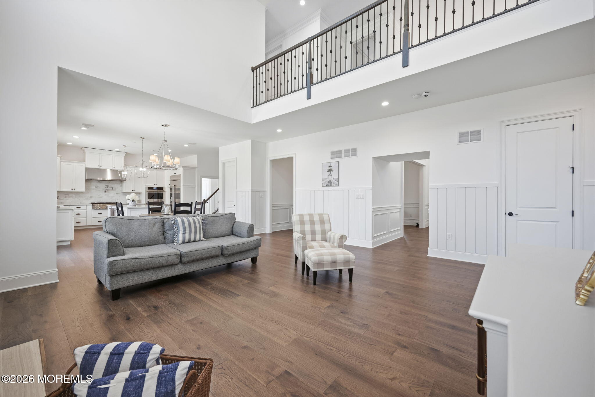 66 Windermere Road Lincroft, NJ 07738 - Photo 17 of 48 a living room with furniture wooden floor and kitchen view