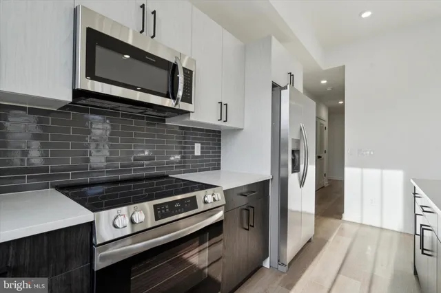 a kitchen with a stove and a microwave