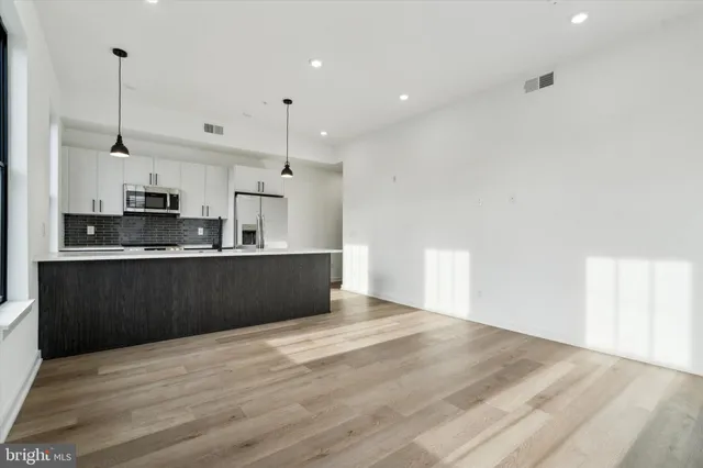a view of kitchen with wooden floor