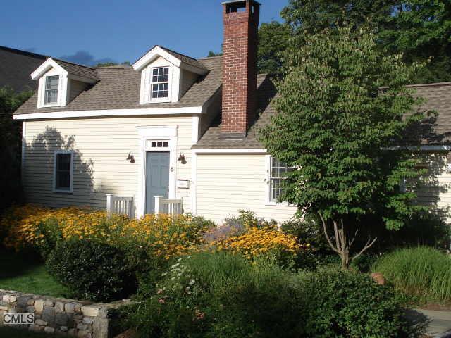 5 Abbott Avenue Ridgefield, CT 06877 - Photo 1 of 1 a yellow house with trees in front of it