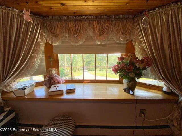 a bed room with a bed and a window