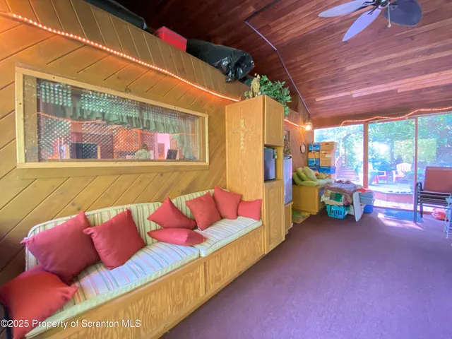 a view of a house with backyard sitting area and garden