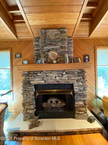 a living room with furniture a rug and a large window