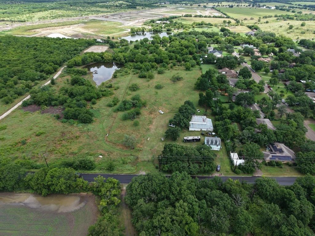 2965 Hartlee Field Road Denton, TX 76208 - Photo 5 of 6 a backyard of a house with a yard and lake view