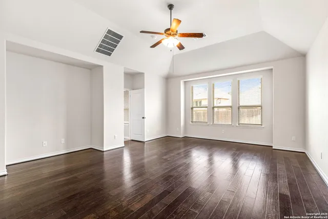a spacious bathroom with a sink a mirror and a bathtub