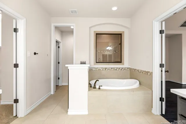 a view of n empty room with a window