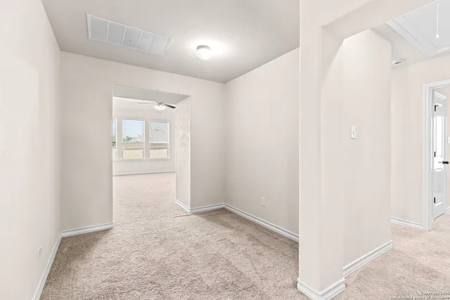 a view of a livingroom with a ceiling fan