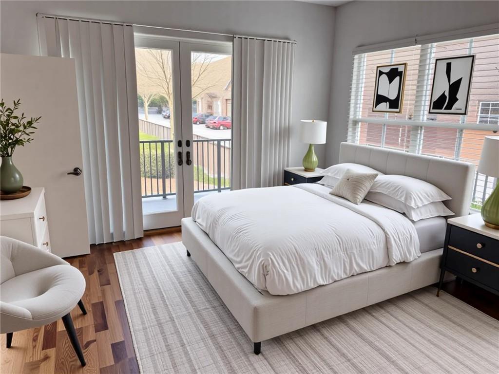 384 Ralph McGill Boulevard Northeast, Unit 121 Atlanta, GA 30312 - Photo 12 of 38 a bedroom with a bed and a large window