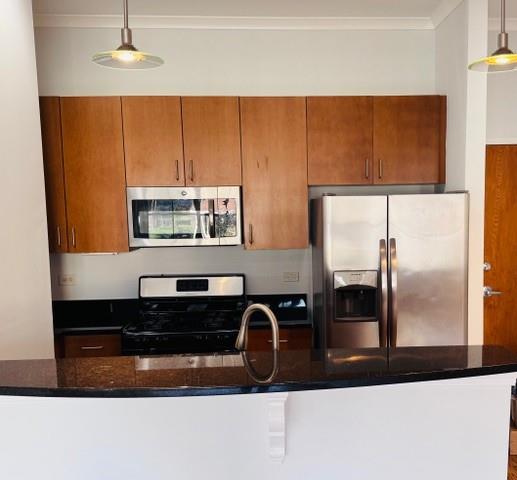 384 Ralph McGill Boulevard Northeast, Unit 121 Atlanta, GA 30312 - Photo 19 of 38 a kitchen with a refrigerator and a counter top space