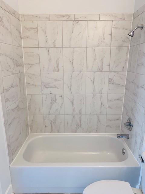 384 Ralph McGill Boulevard Northeast, Unit 121 Atlanta, GA 30312 - Photo 24 of 38 a bathroom with a shower and a bathtub