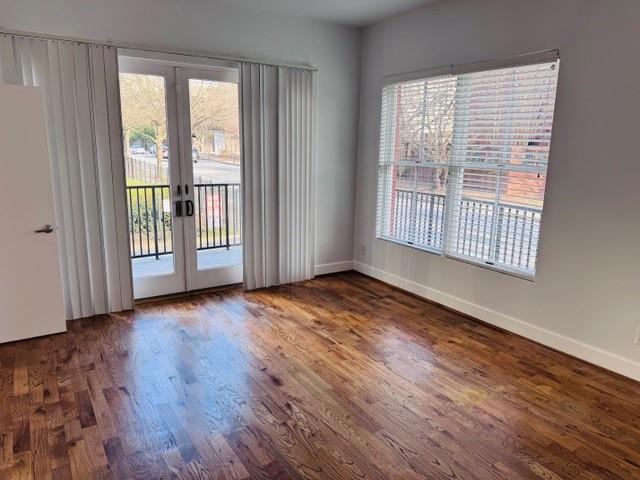 384 Ralph McGill Boulevard Northeast, Unit 121 Atlanta, GA 30312 - Photo 27 of 38 a view of an empty room with wooden floor and a window