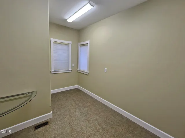 a kitchen with stainless steel appliances granite countertop a sink refrigerator and cabinets