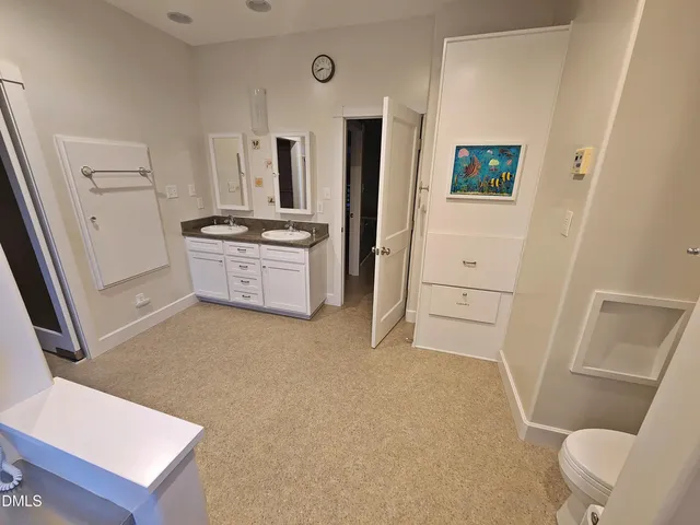 a bathroom with a toilet and a sink