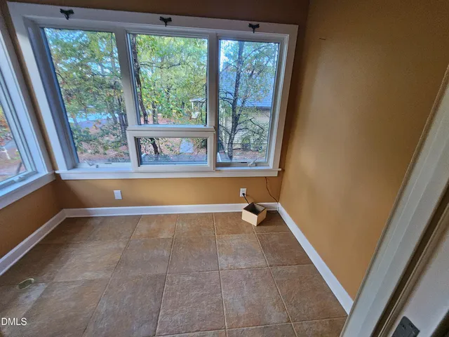 a view of empty room with ceiling fan
