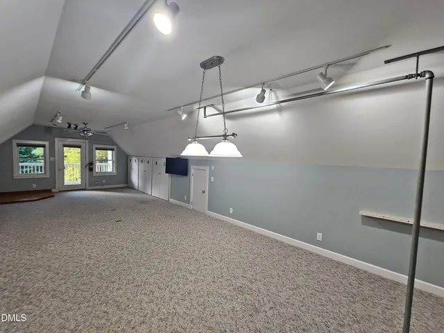 a view of a livingroom with a fireplace and furniture