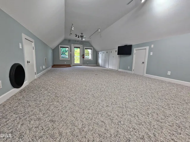 a view of a room with window and chandelier