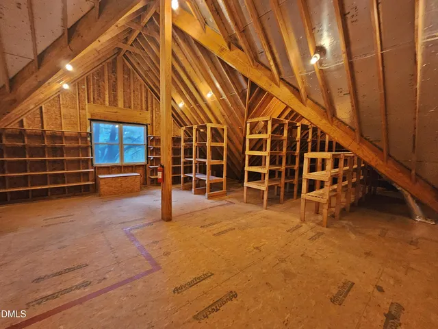 a view of a room with window and stairs