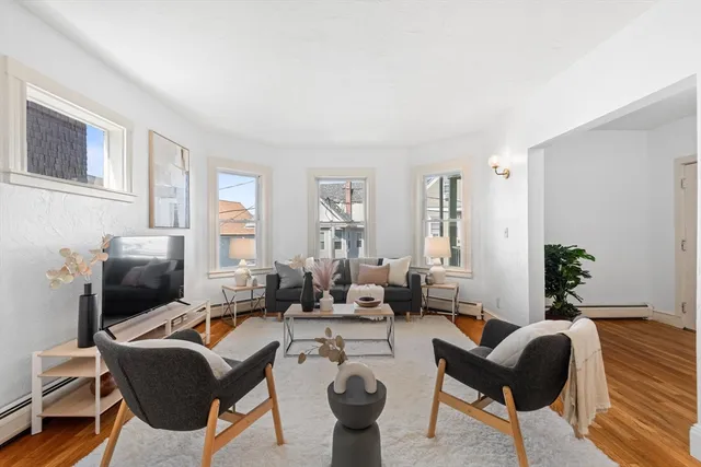 a living room with furniture or couch and a potted plant