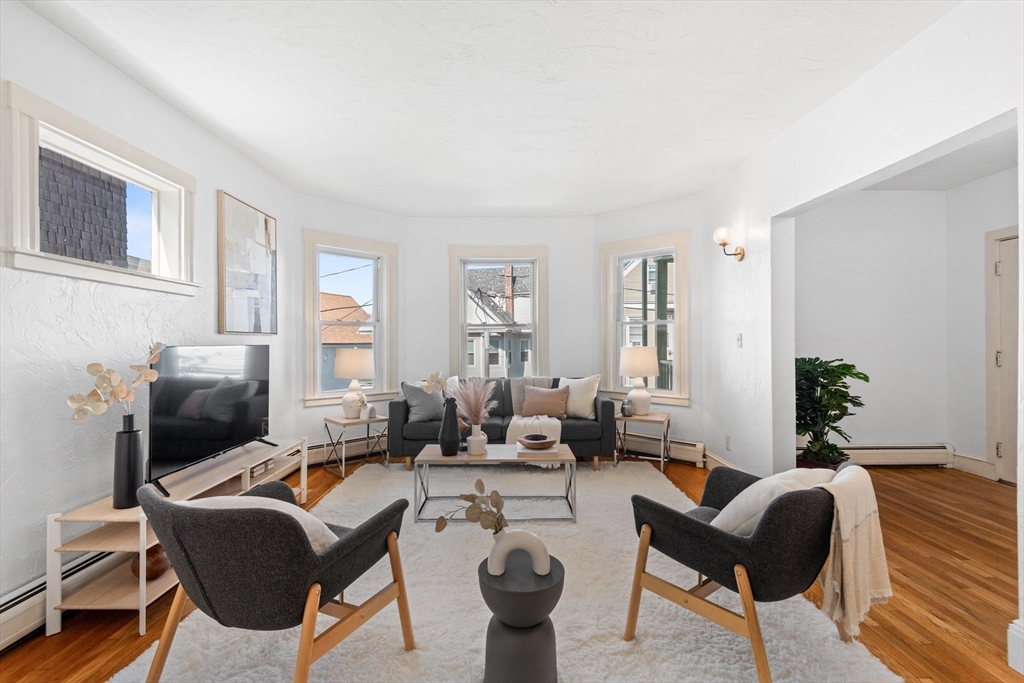 11 Weld Hill Street, Unit 2 Boston, MA 02130 - Photo 5 of 17 a living room with furniture or couch and a potted plant