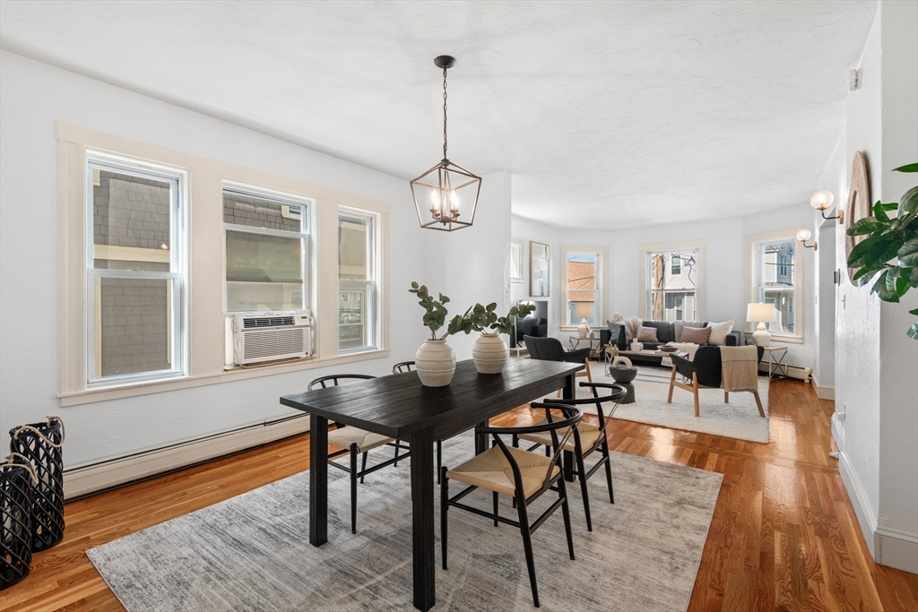 11 Weld Hill Street, Unit 2 Boston, MA 02130 - Photo 7 of 17 a view of a dining room with furniture window and wooden floor