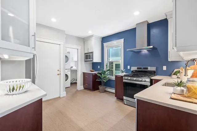 a kitchen with a stove and a refrigerator