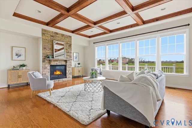 a kitchen with stainless steel appliances a stove a sink a refrigerator and white cabinets