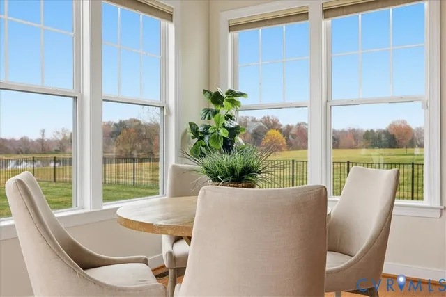 a bed room with a bed and three large windows