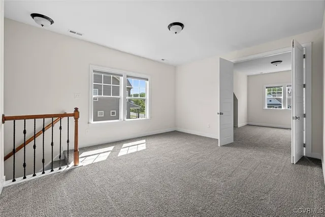 an aerial view of a house with a lake view