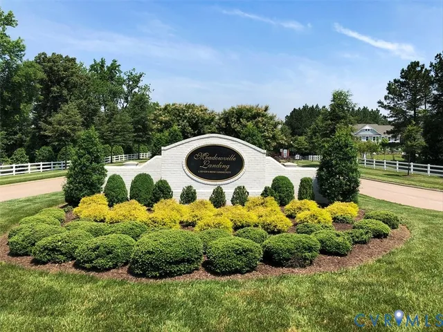an aerial view of a house with garden space and outdoor seating