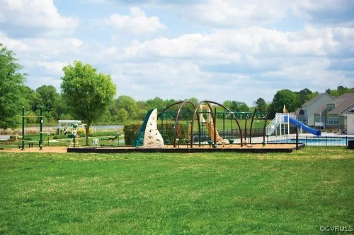 a view of a swimming pool with a yard