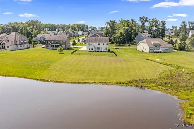 an aerial view of a house with a ocean view