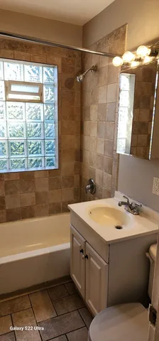 a bathroom with a sink and a bathtub