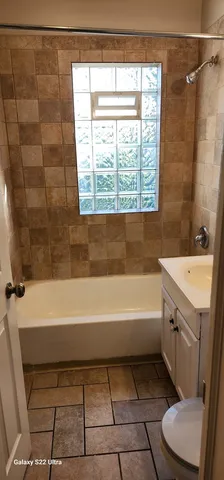 a bathroom with a sink and a bathtub